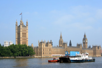 Fototapeta na wymiar Barges on Thames beside Parliament, London