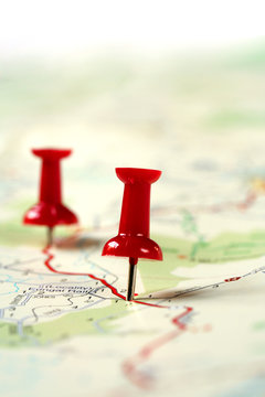Fototapeta A map route marked with red push pins.  