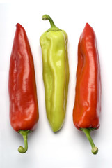 Three sweet peppers over white background.