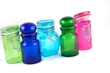 5 colourfull jars on a white background