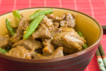 asian food of beef and vegetables on brown bowl