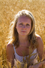 Pretty womans portrait in wheat field