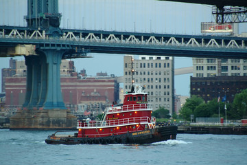 Red Tug boat on the east River lower manhattan