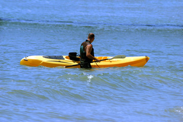 Man kayaking on his vacation in California