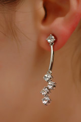 Earring with diamonds on the woman ear