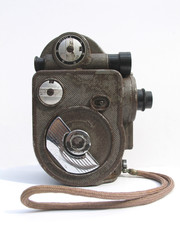 Vintage filming camera over white background