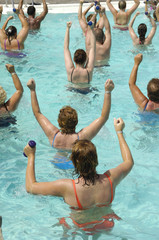 People doing aerobic in a swimming pool