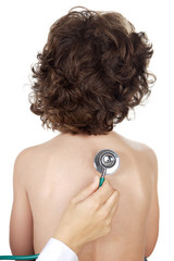 hand with stethoscope examining a boy a over white background