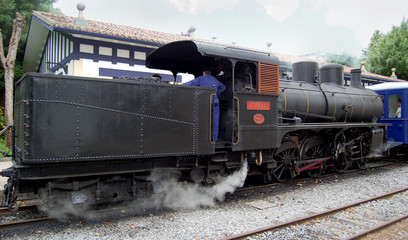 Fototapeta na wymiar Antique train parked in a station