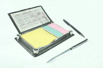 notepad with calendar, ballpen, and letter opener 