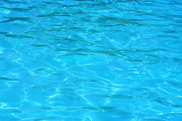 Fototapeta na wymiar water background / swimming pool / surface / texture