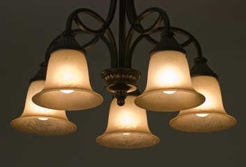 Obraz premium Warm light from chandelier