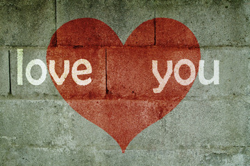 inscription on wall I love you with red heart