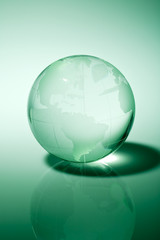Glass world globe in green tone
