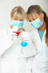Female lab workers testing and experimenting