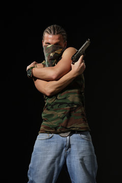 man in mask with gun