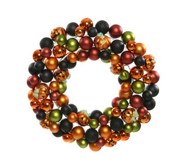 A decorative colorful Halloween wreath isolated over white