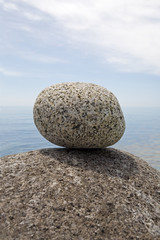 Fototapeta na wymiar Large granite stones of sea coast.