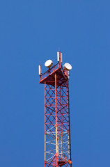 Cellular communication tower on blue sky