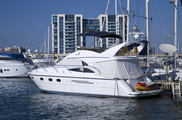 Luxurious motor yacht docked in marina