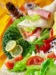 grilled chicken and vegetables wrapped in a whole wheat tortilla