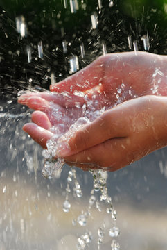 Hands catching clean water close up. Environmental concept.