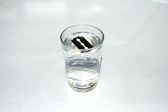 The edge floats in a glass