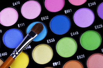 A make-up multi colored palette close up.