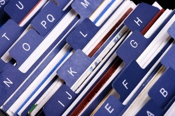 Close up of desktop business card index holder.