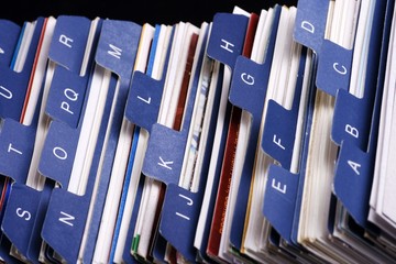 Close up of desktop business card index holder.