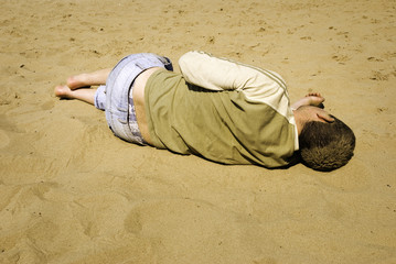  man blind drunk  on the beach 
