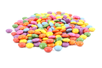 pile of colorful candies isolated on white