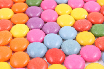 Fototapeta na wymiar close-ups of colorful candies - background