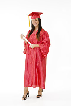 A Female Caucasian In Red Graduation Gown 