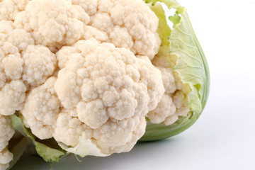 cauliflower with leaves on white background
