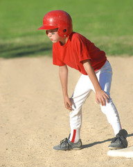 child getting ready to steal a base