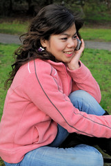 Asian girl talking on a mobile phone