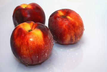  peaches on white background