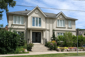 Large stucco house with two gables