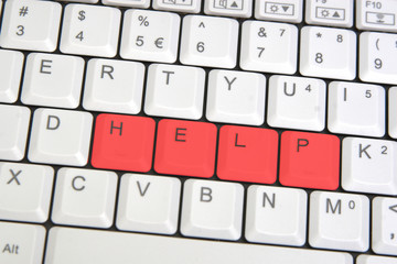 Closeup of laptop keyboard with HELP sign