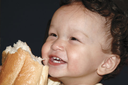 The cild with baguette.