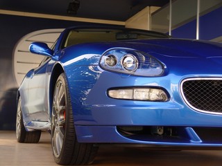 New blue car in garage