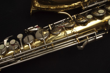 Saxophone against black, horn and keys