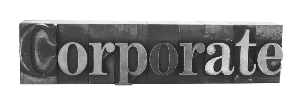 the word 'corporate' in old, inkstained letterpress metal type