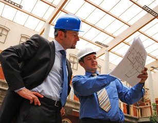 architect and supervisor  Reviewing Blueprints