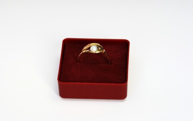 Ring with a pearl in the box