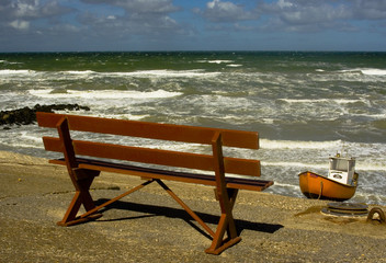 Bench staring at violent sea