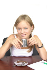 beautiful young smiling girl with a cup and papers in the office