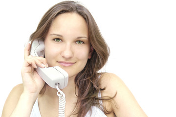 beautiful young smiling girl with a telephone