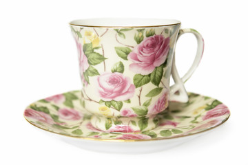teacup on sucer decorated with pink roses